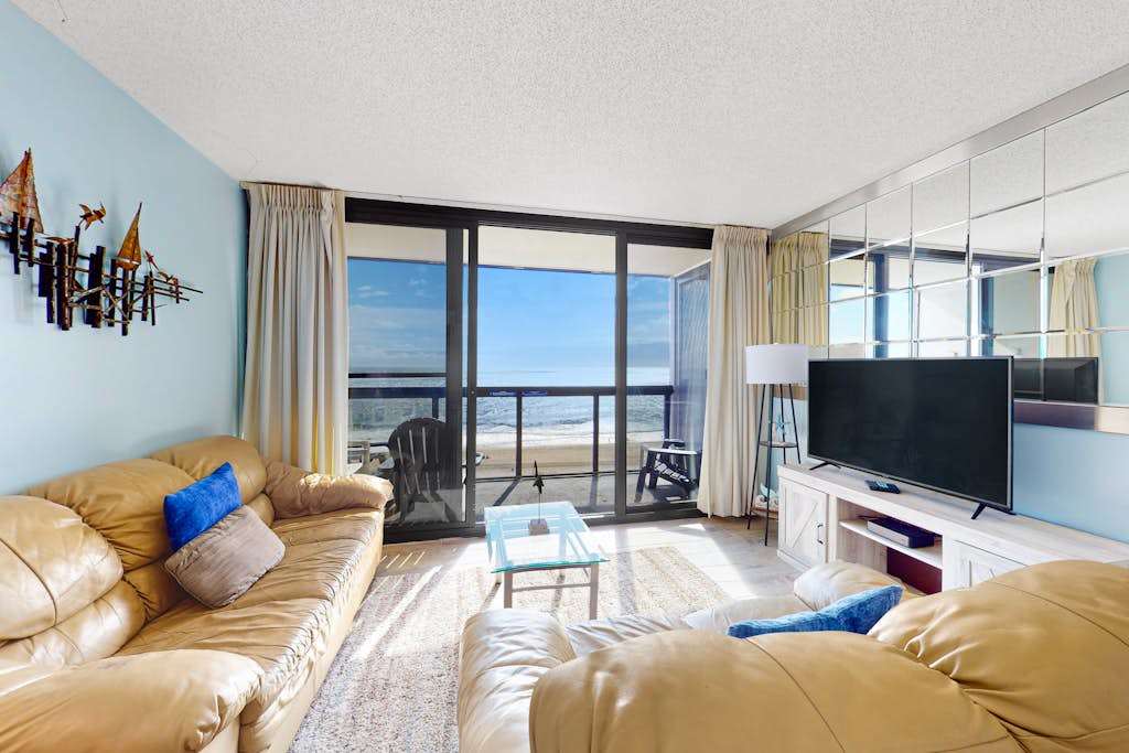 Classic, alluring beachfront condo with balcony, views, pools, gym & tennis