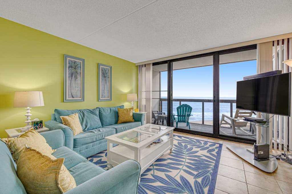 Lovely beachfront condo with balcony views, pools, tennis & gym