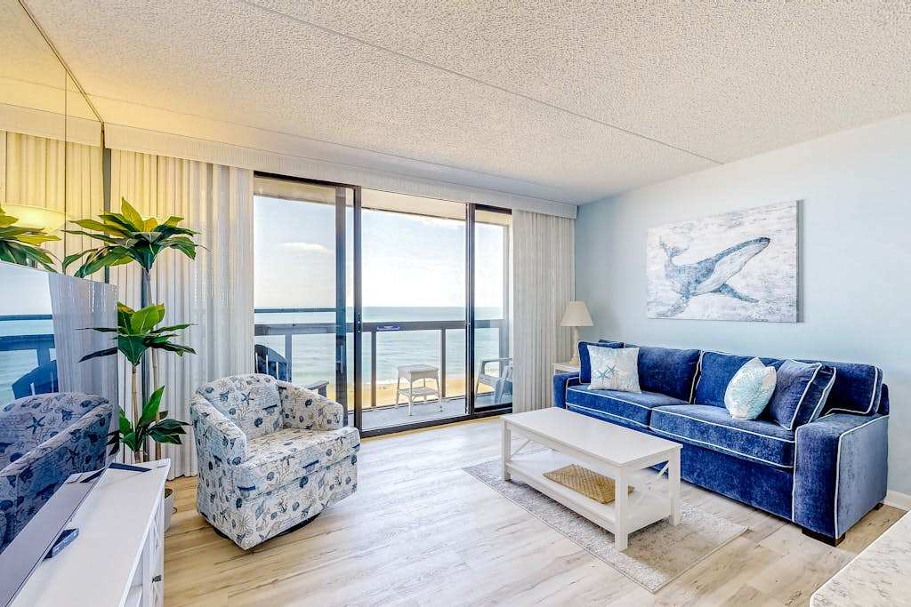 Captivating beachfront condo with balcony views, pools, gym & tennis court