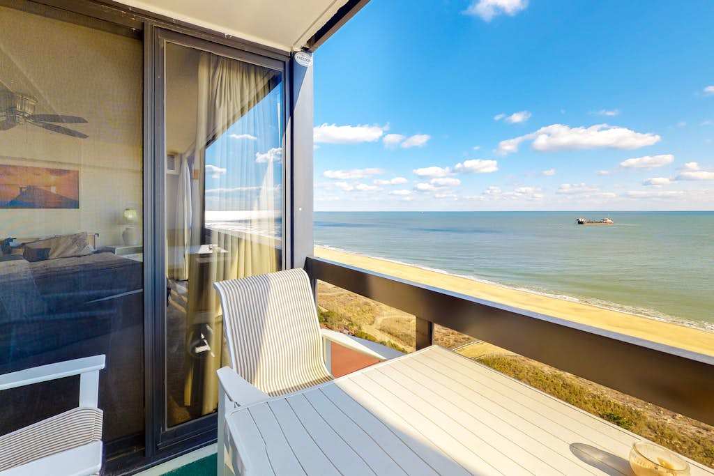 Affordable condo with furnished balcony, water views & pools