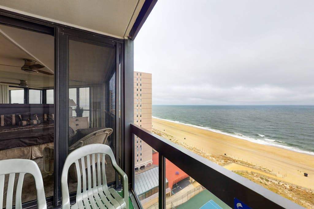 Waterfront condo with balcony, beach views, pools & gym