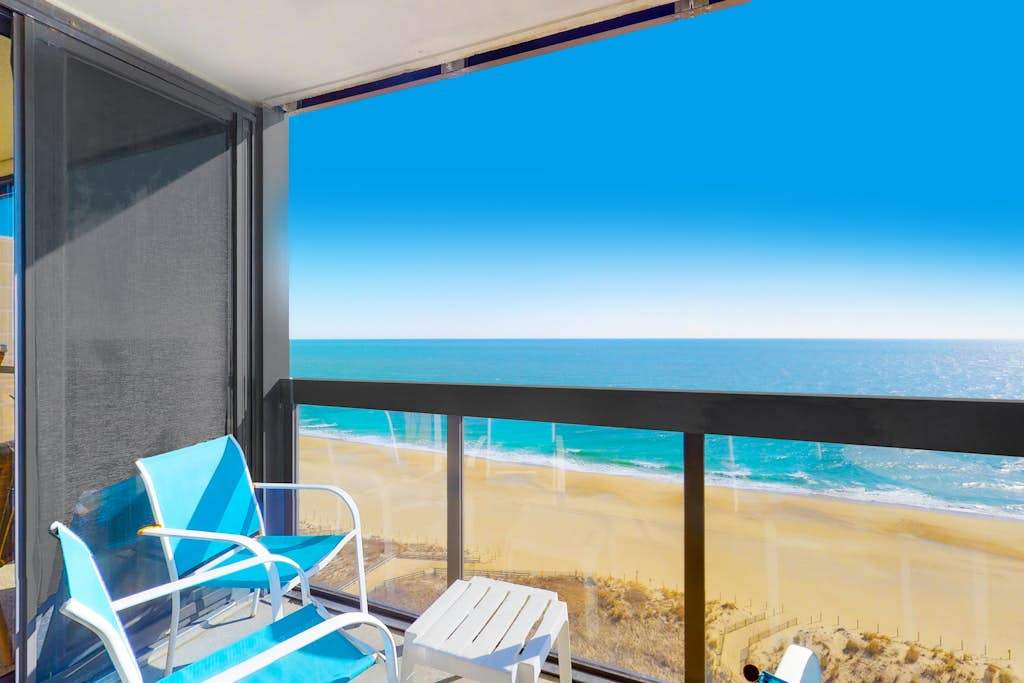 Incredible waterfront condo with furnished balcony, beach views, pools & gym