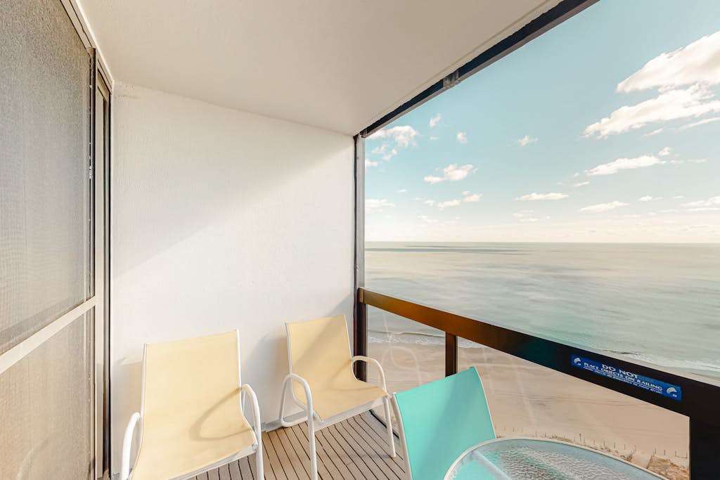 Updated oceanfront condo with ample balcony, AC, pools, gym & sauna