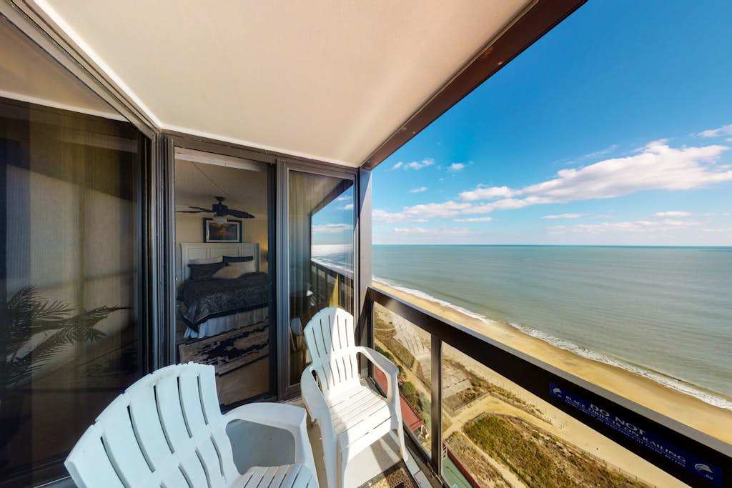 Inviting beachfront condo with great balcony views & pools