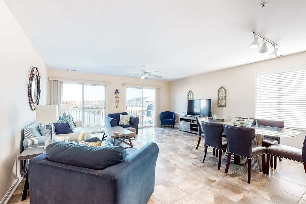 Waterfront Condo on the Canal with Deck & Shared Pools & Tennis - Walk to the Beach