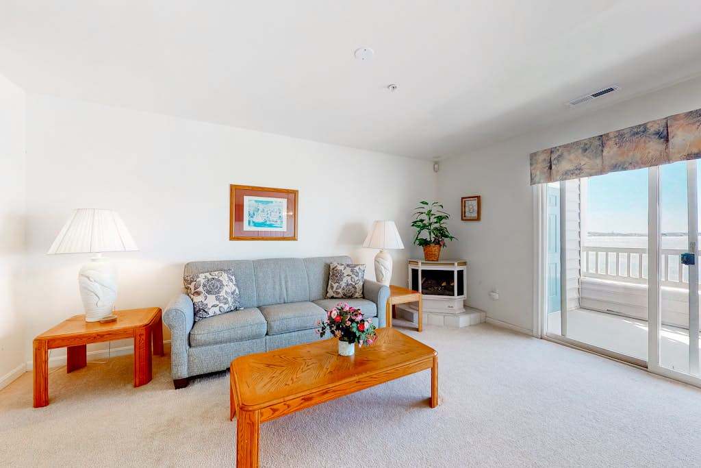 Wonderful bayfront condo overlooking the marina with pool, balcony & fireplace