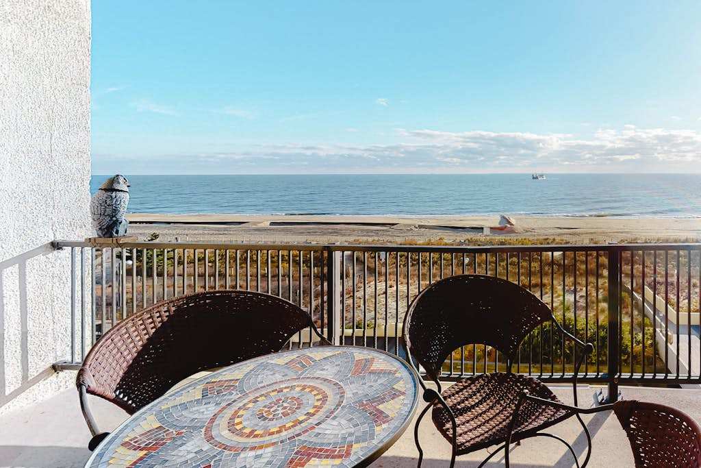 Oceanfront condo with pool, AC, balcony, & washer & dryer