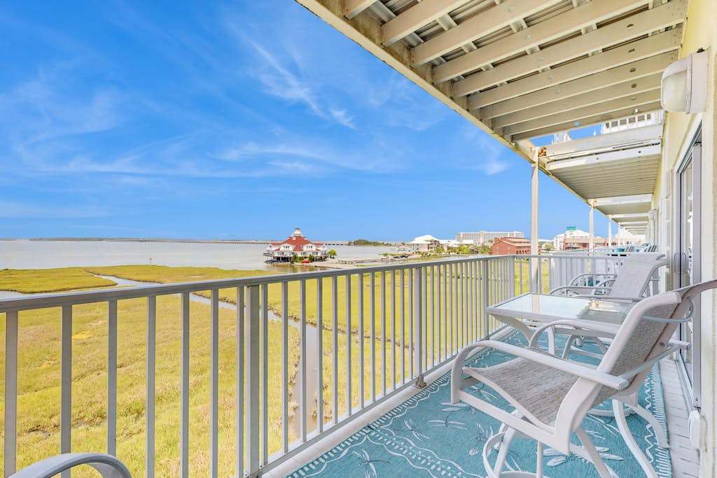 Ideal fourth-floor condo with bay views from living room & balcony & pool