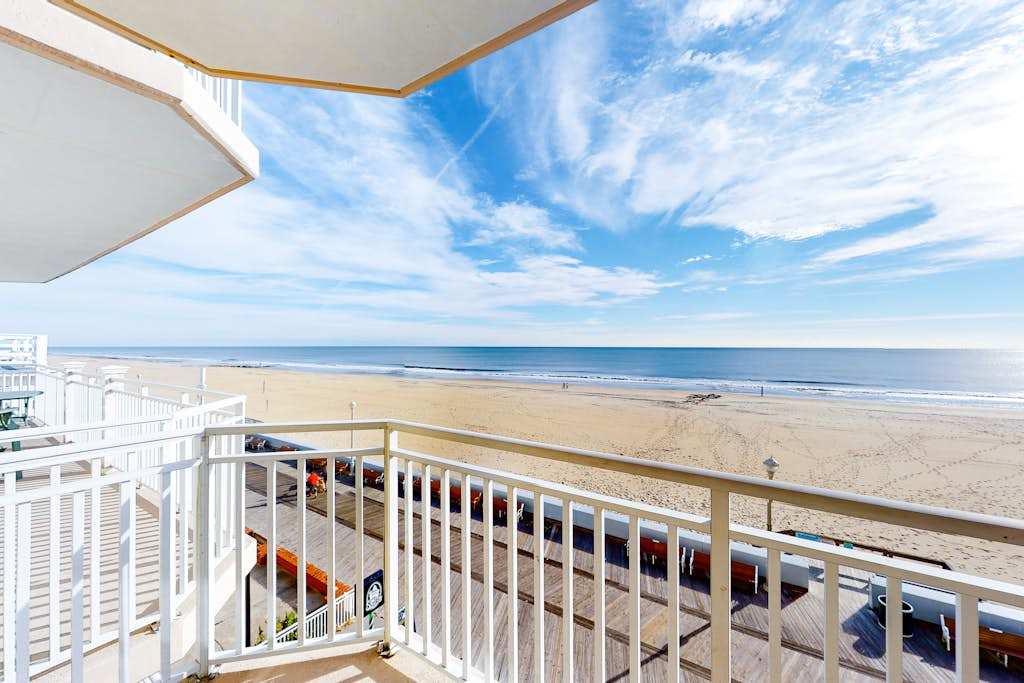 Incredible Beachfront Condo with Private Balcony, Fireplace, AC, & Shared Pool