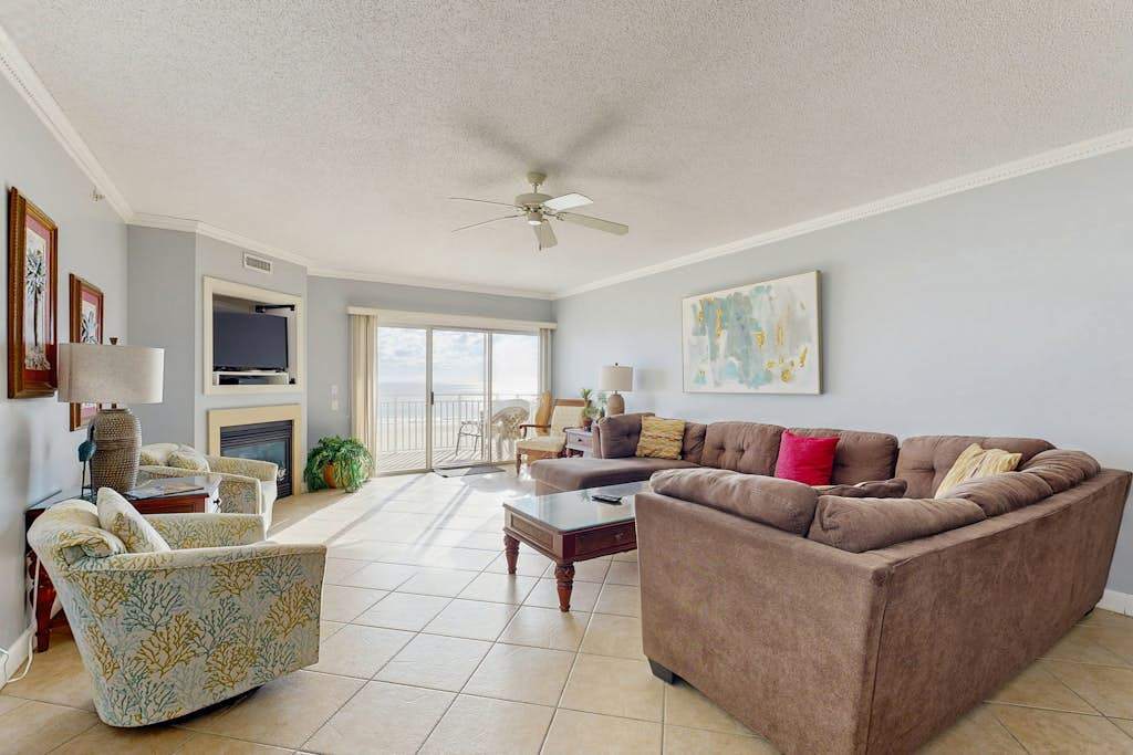 Lovely beachfront condo with ocean view, pool, balcony, fireplace, AC, & washer & dryer
