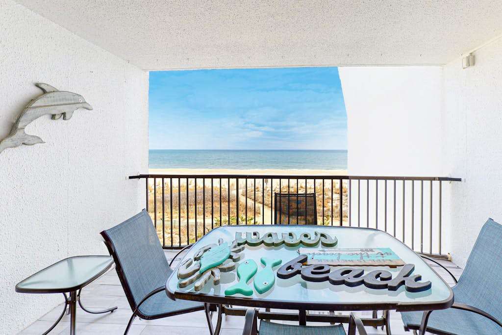 Oceanfront Condo with Shaded Balcony, WiFi, Laundry, AC & Shared Pool
