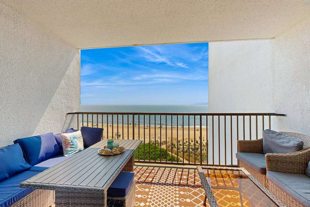 Bright, oceanfront condo with balcony, AC, laundry & outdoor pool