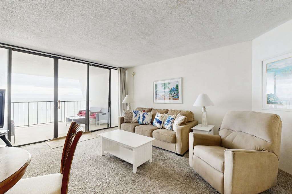 Oceanfront Condo with a Shaded Balcony, AC, WiFi, Laundry & Shared Pool