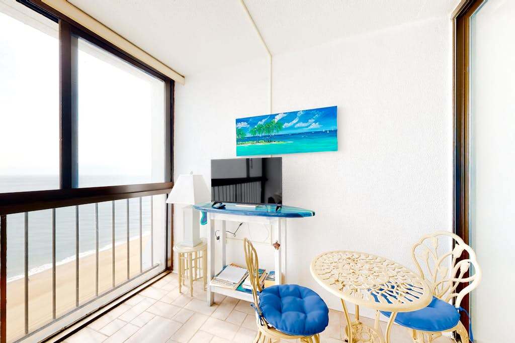 Newly updated oceanfront condo with enclosed balcony, AC, WiFi & shared pool