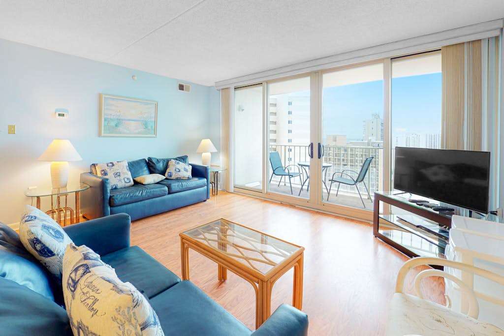 Convenient condo with side ocean views, balcony, pools, & tennis