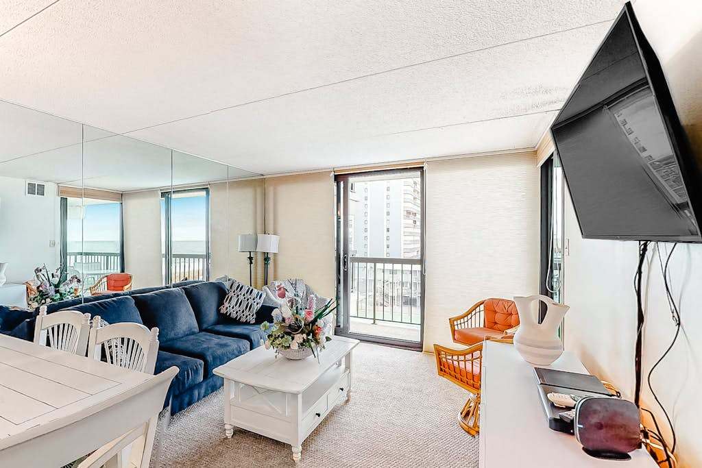 Alluring inviting condo with beach & tennis views, balcony, pools & AC