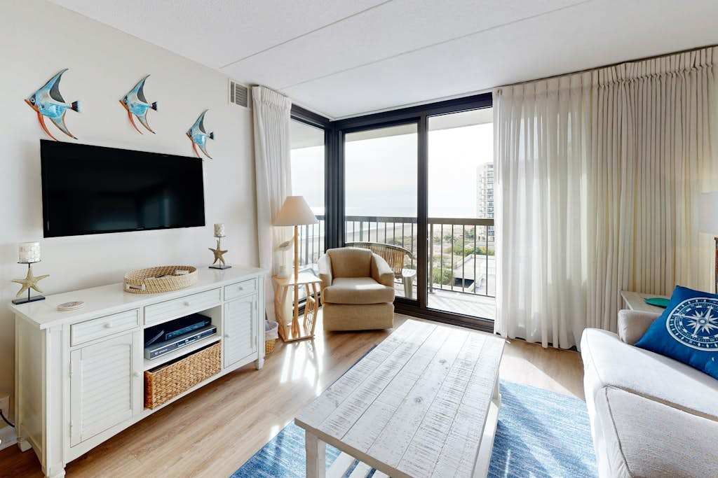 Bright, ocean-view condo with balcony, AC, pools, saunas & gym