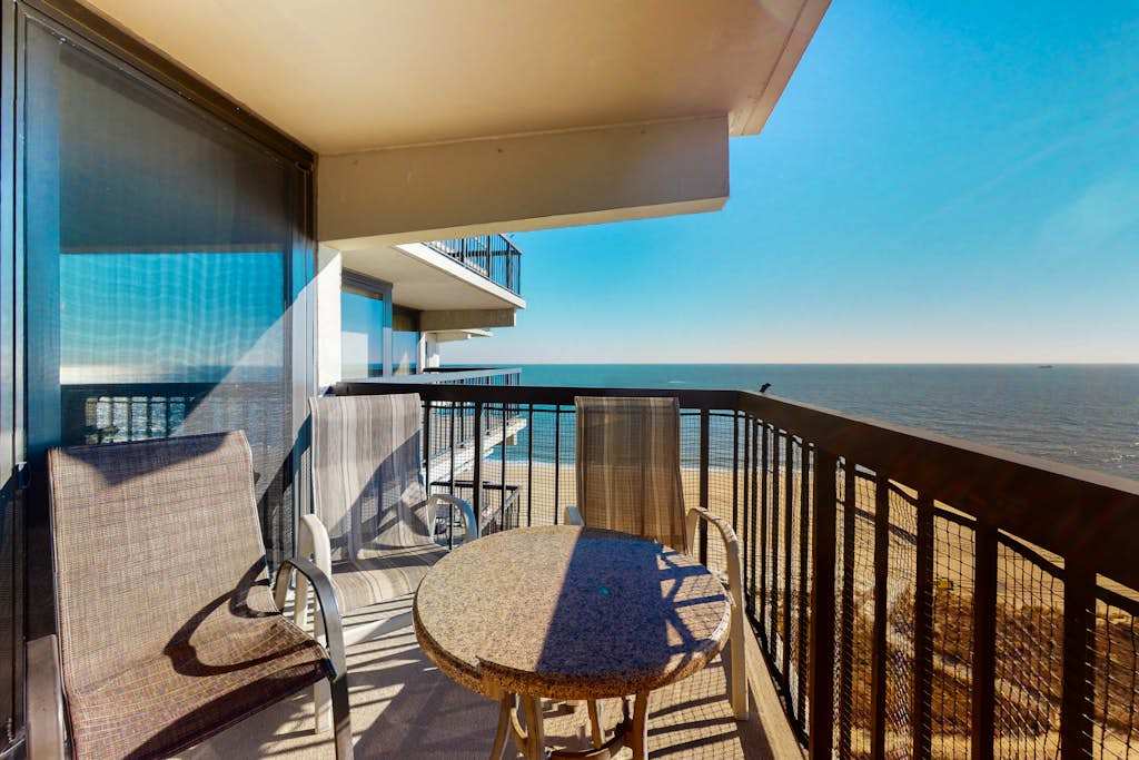 Stunning beach condo with balcony, views, pools, gym, game room & sauna