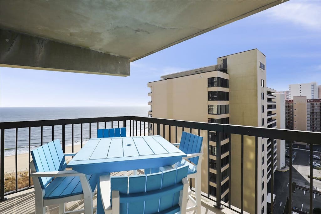 Beachfront corner condo with balcony, views, pools, game room, gym & sauna