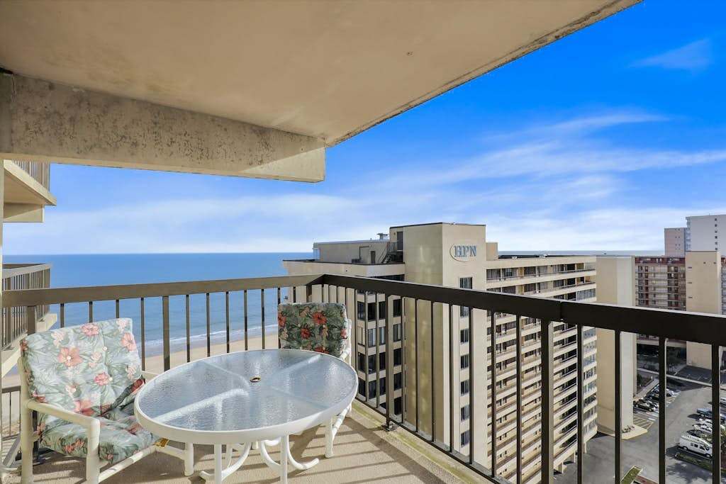 Bright beach condo with balcony, views, pool, game room, tennis court & AC