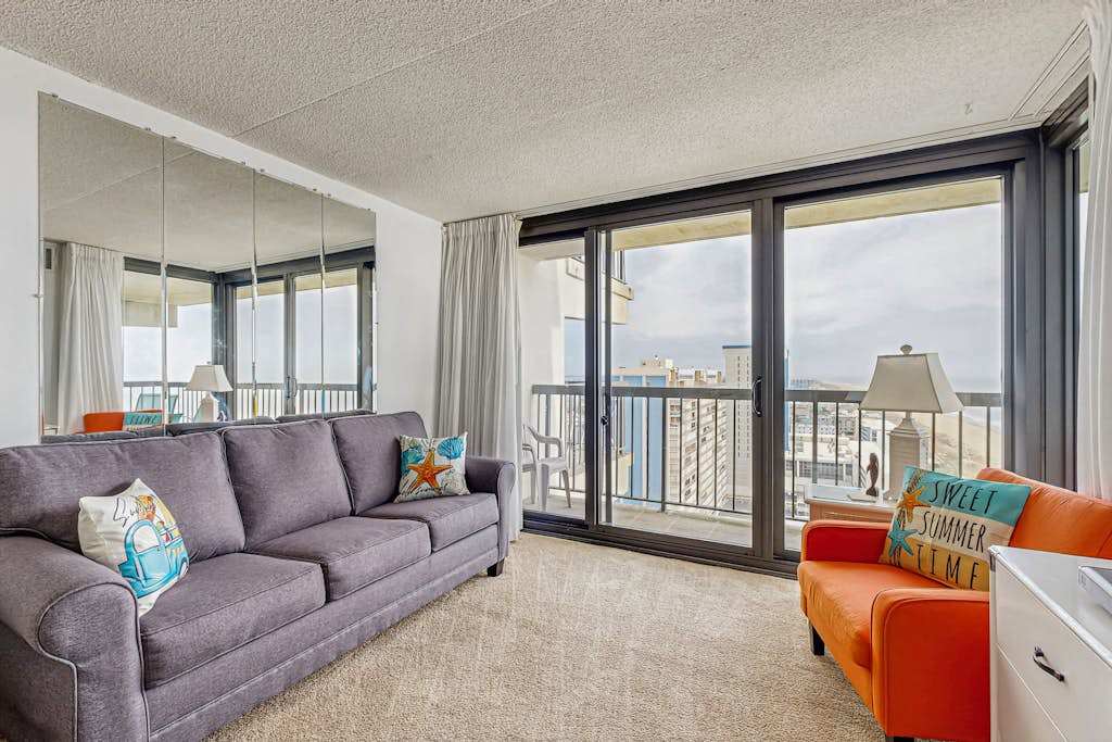 Sun-kissed beach condo with balcony, pools, game room, tennis & AC