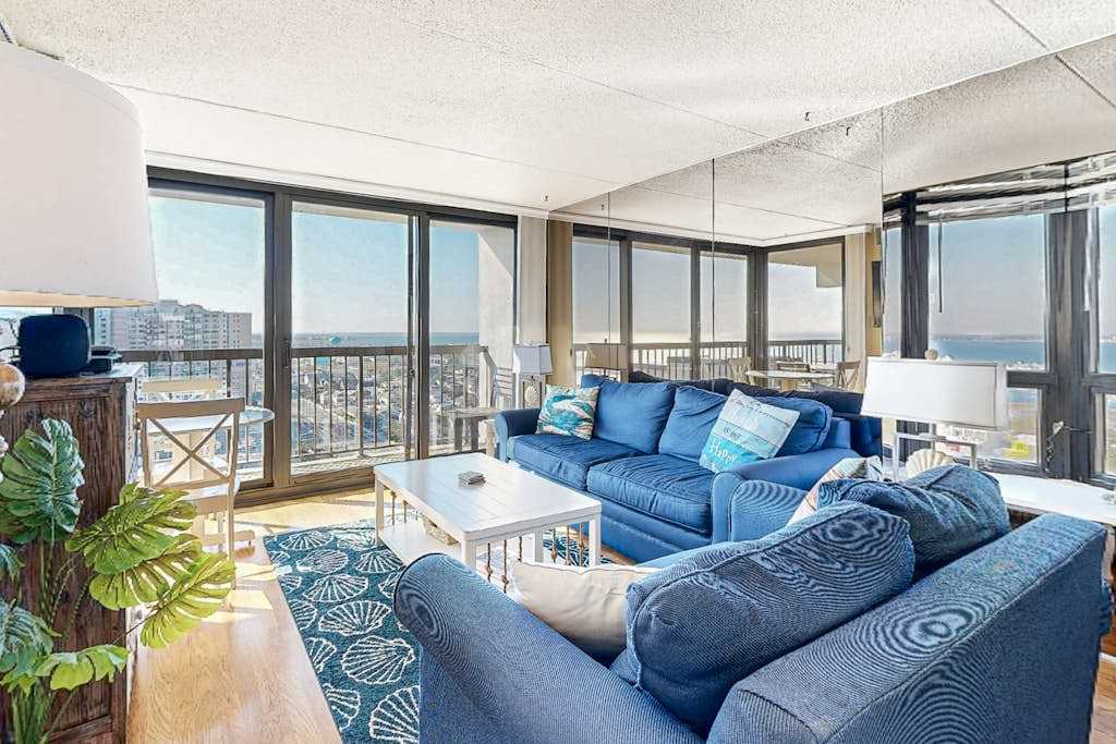 Coastal-themed beach condo with balcony, views, pools, tennis & central AC