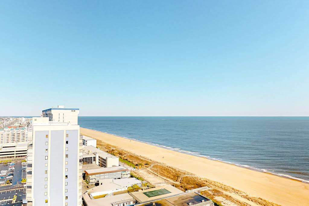 Stylish beach condo with prime beach views, balcony, pools, gym & sauna