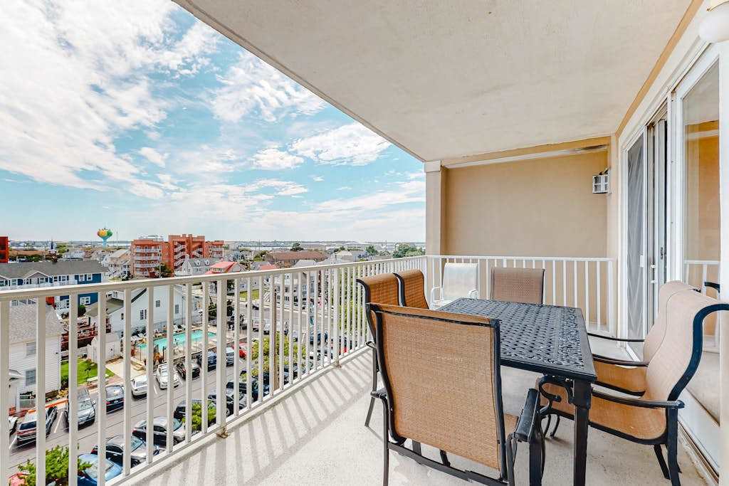 Updated condo in oceanfront building with side ocean view, pool, & gym