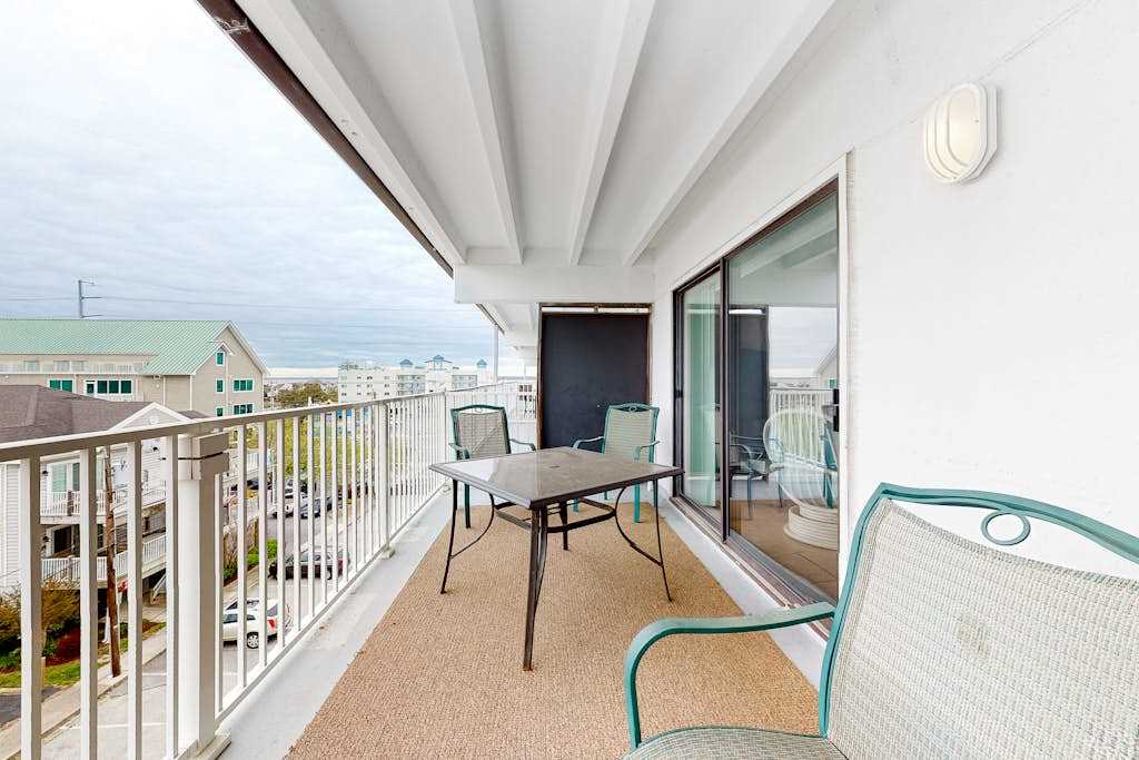 Walk to the Beach Ocean Block Condo with Balcony, AC, WiFi & Shared Pool