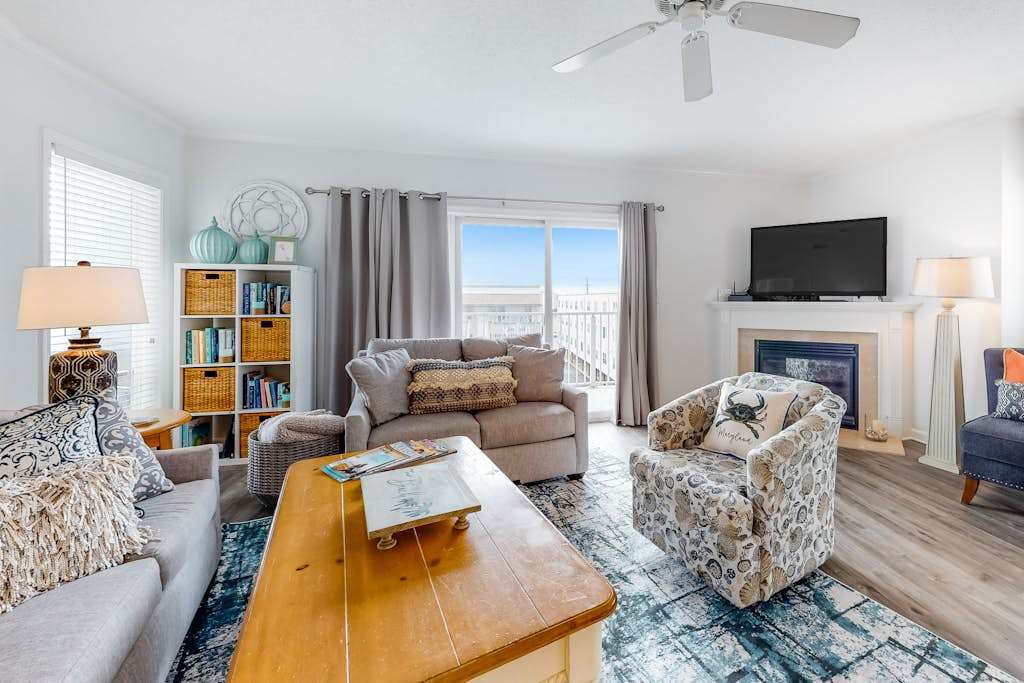 Renovated Corner Condo with Ocean View Balcony, Fireplace, & Shared Pool
