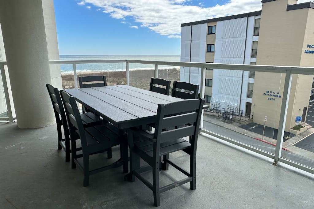 Ocean View Condo Steps from the Beach with Balcony, WiFi, AC & Shared Pool