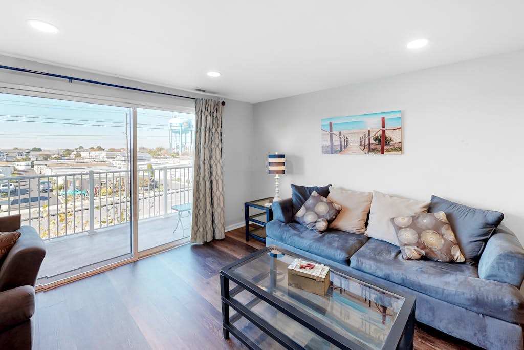 Condo One Block from the Beach with Balcony, AC, Laundry & Shared Pool