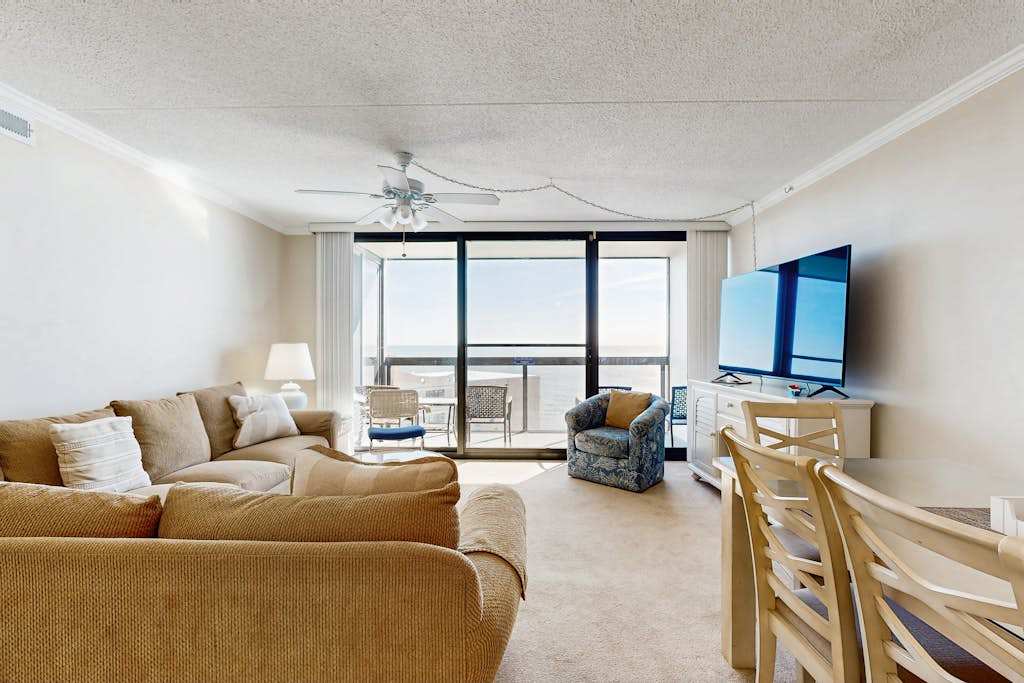 Beachfront resort condo with central AC, ocean views, balcony, pools & amenities