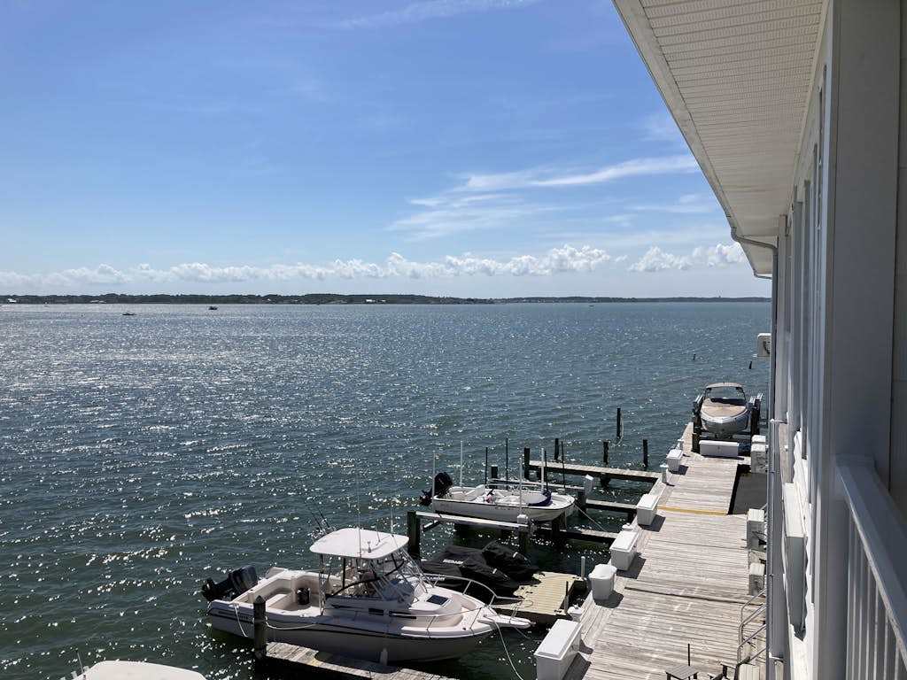 Renovated bayfront condo with water-view balcony & fast WiFi - walk to beach