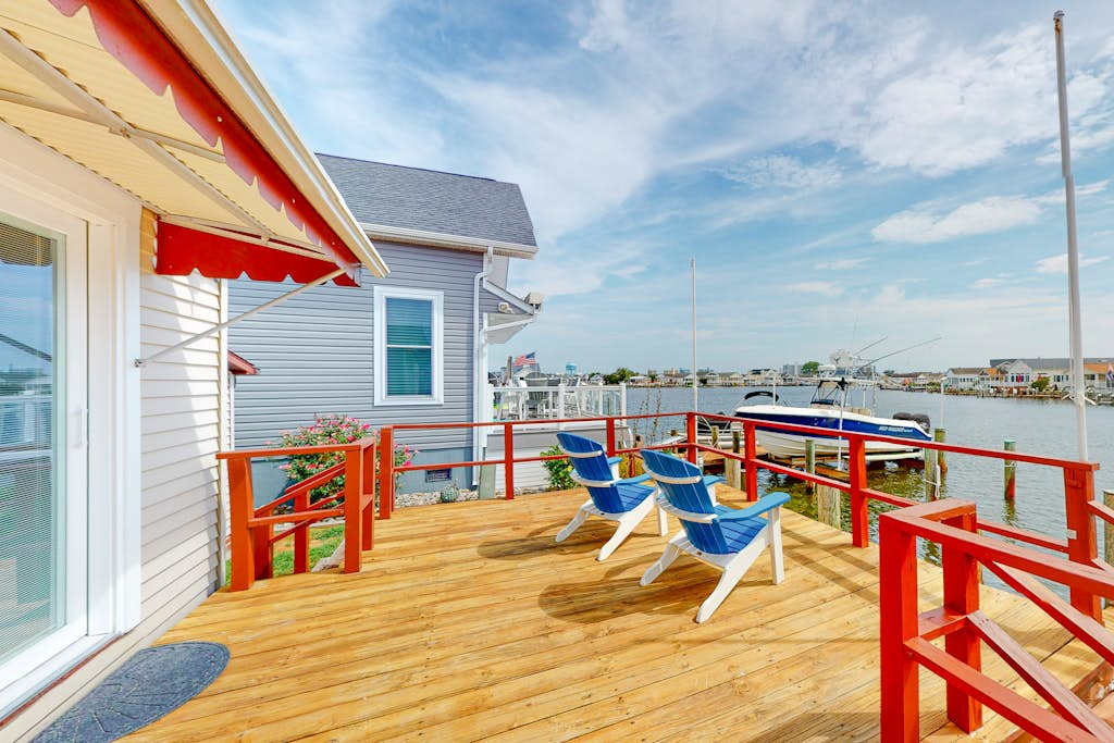Renovated waterfront home with dock, bay access, & shared pool & tennis