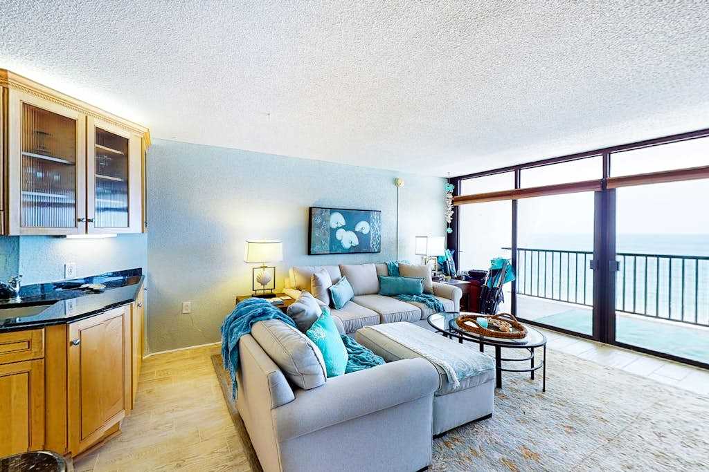 Updated beachfront condo with balcony, ocean view, WiFi, washer & dryer, AC, & pool