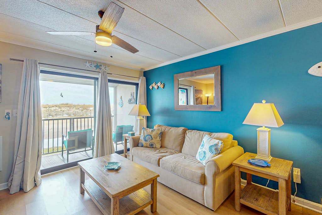 Charming 1st floor - beach front condo, with balcony, full kitchen, AC, & WD