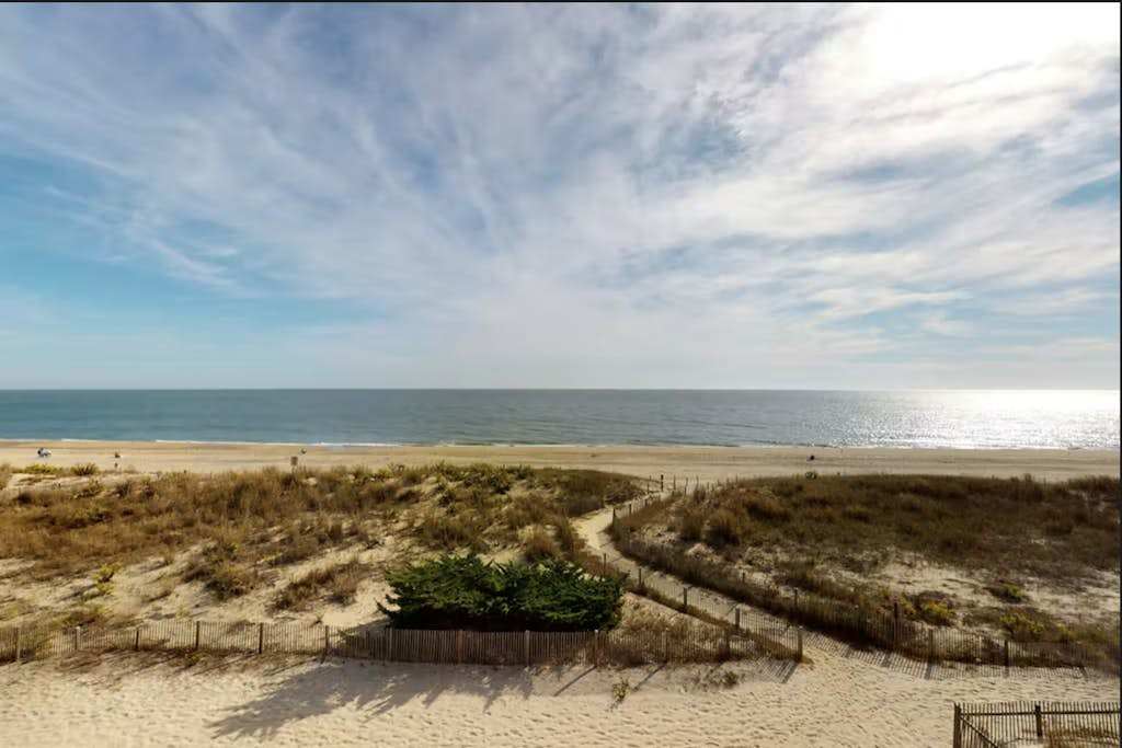 4-Story beachfront townhome with ocean views, balconies, deck, outdoor shower
