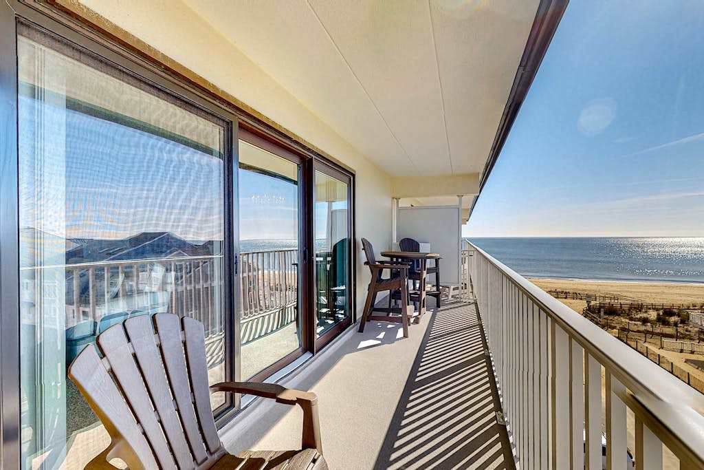 Water view condo with beach and pool access - balcony, washer & dryer, and central AC