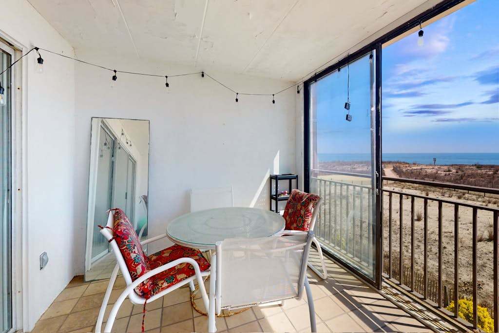 Waterfront condo with a scenic balcony, pool, beach access, AC, & washer & dryer