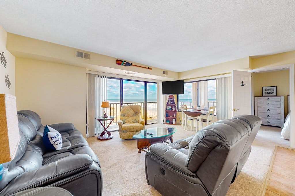 Corner unit ocean view condo with large balcony, direct beach access, & washer & dryer