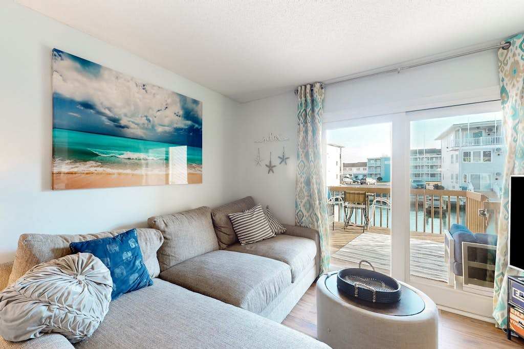 Waterfront condo with scenic balcony, games, fireplace, & washer & dryer - dog-friendly