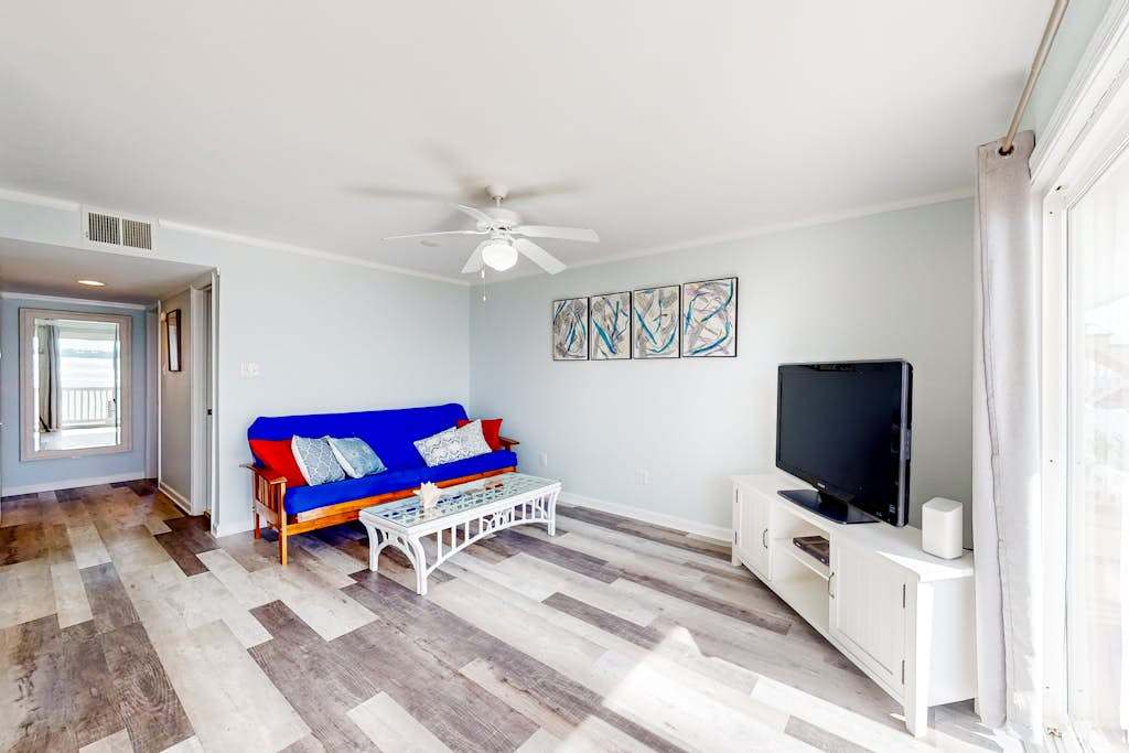 Waterfront condo with bay views, private deck, & on-site pool