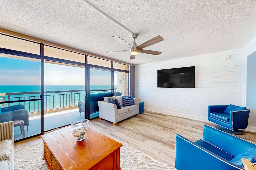 Beachfront condo with outdoor pool, bay & sunset views, large balcony, & tennis