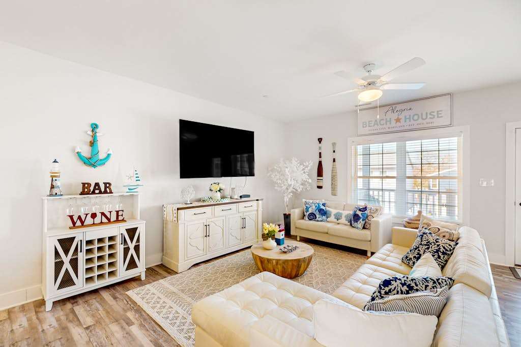 Upscale canal-front townhome with pool, beach access, dock, balconies, & desks
