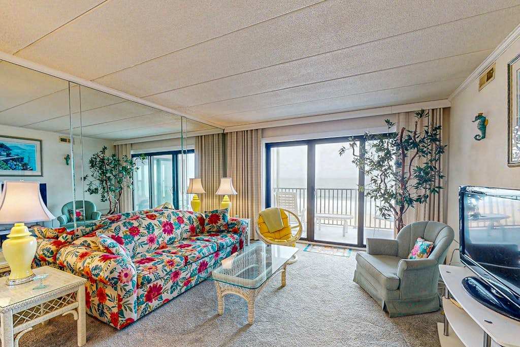 Waterfront condo with ocean views, beach access, private balcony, washer & dryer, & Central AC