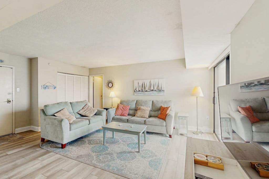 Sunny mid-town Condo with water-views, beach access, pool, sundeck, & gym