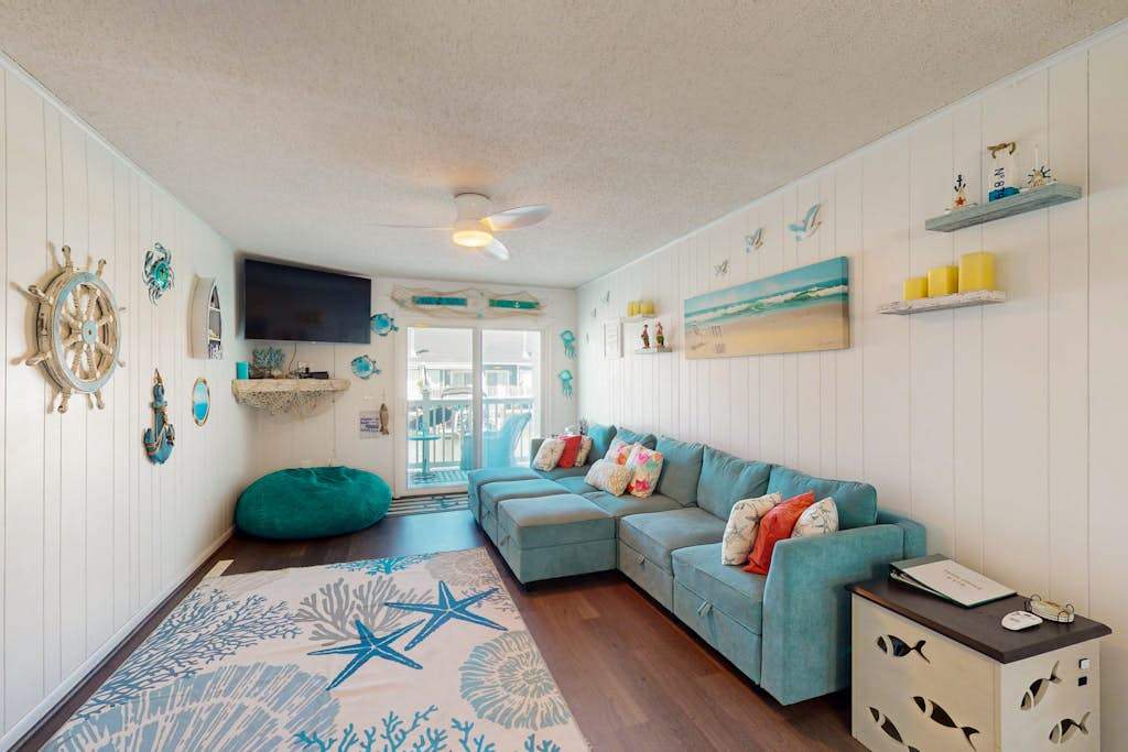 Sunny canal side condo - with balcony, short walk to the beach, boardwalk, & parks