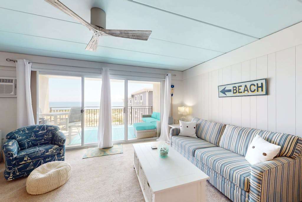 Charming beach condo with balcony, beach views, shared pool, AC & washer & dryer