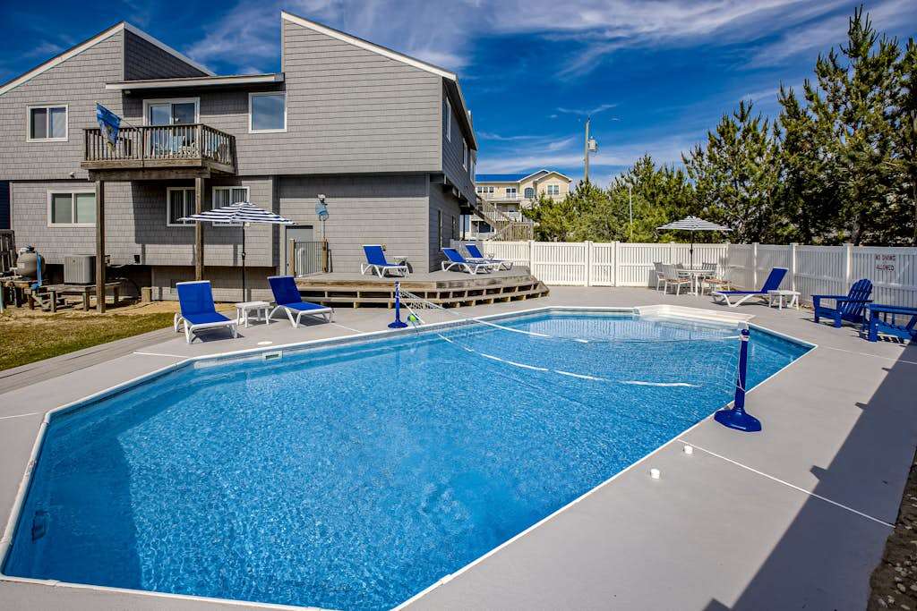 Bright and comfortable home steps from beach with private pool, WiFi, & central AC